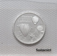 Schweizer 20-Franken-Silbermünze 2025 „Pioniere der Schweizer Luftfahrt“ in Stempelglanz: Heissluftballone vor Alpenkulisse; Wertseite mit Propeller-Anspielung und „20 FR“.