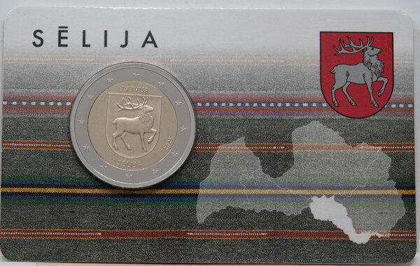 2 Euro Gedenkmünze Lettland 2025 „Sēlija“ in Coincard-Verpackung: Vorderseite zeigt das Wappen der Region Sēlija mit Schriftzug „LATVIJA“ und Jahreszahl 2025; Münze ist bimetallisch, Ø 25,75 mm.